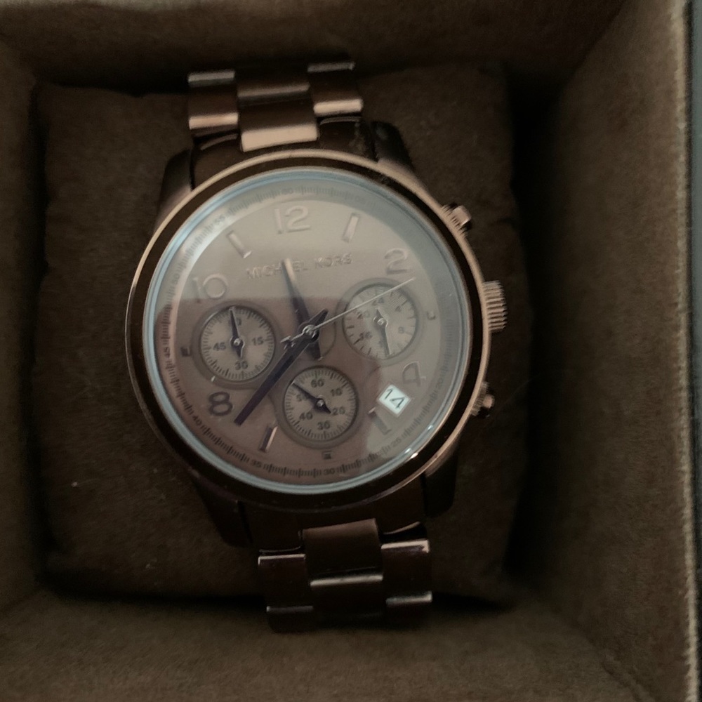 A brown MK 5492 watch